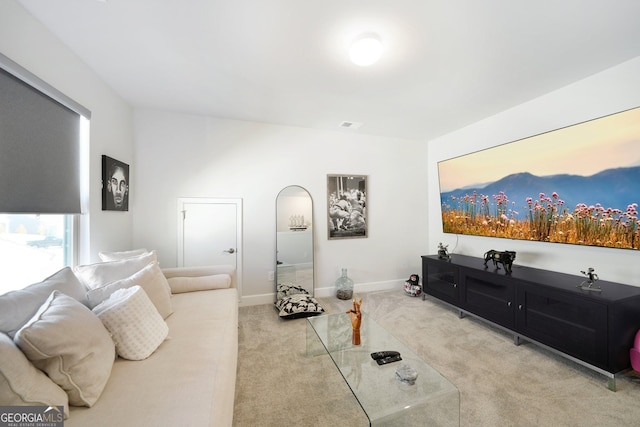 living room with carpet floors and baseboards