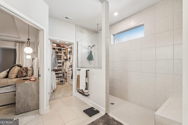 full bath with visible vents, radiator, tile patterned flooring, a spacious closet, and walk in shower