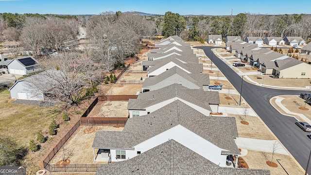 birds eye view of property with a residential view