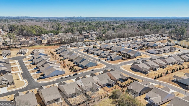 birds eye view of property with a residential view