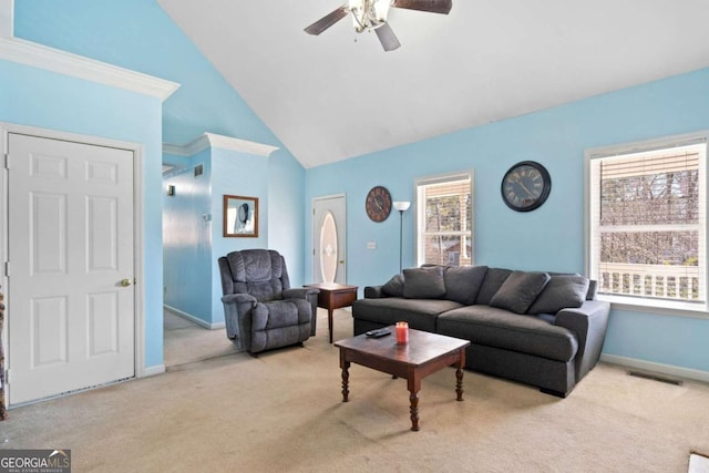 living area featuring visible vents, baseboards, ceiling fan, carpet, and high vaulted ceiling