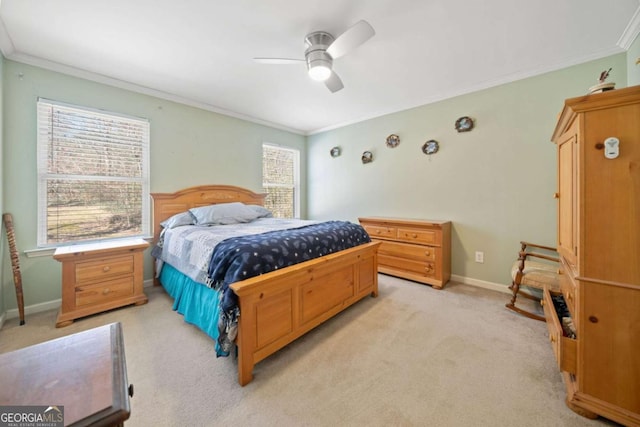 bedroom with ornamental molding, light colored carpet, baseboards, and a ceiling fan