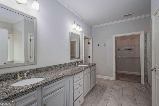 full bathroom featuring crown molding, visible vents, and a sink