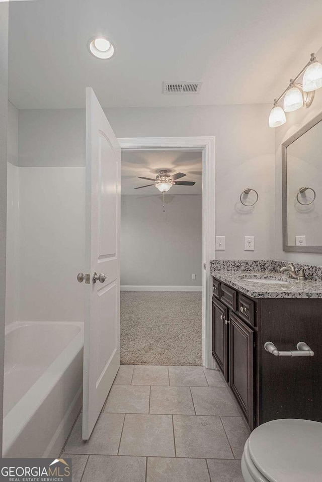 bathroom with ceiling fan, tile patterned flooring, toilet, vanity, and visible vents