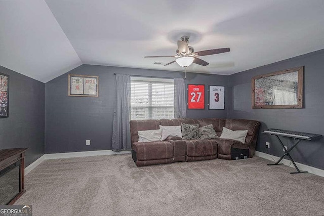 carpeted living room with lofted ceiling, visible vents, baseboards, and a ceiling fan