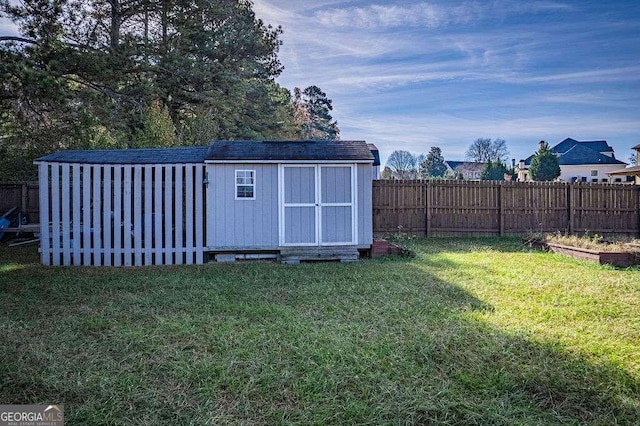 view of shed featuring a fenced backyard