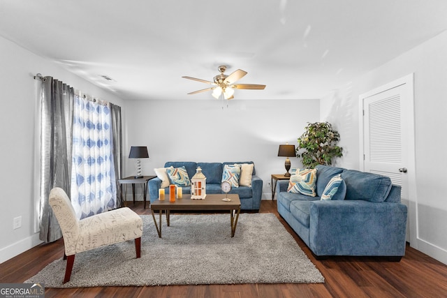 living room with ceiling fan, wood finished floors, and baseboards