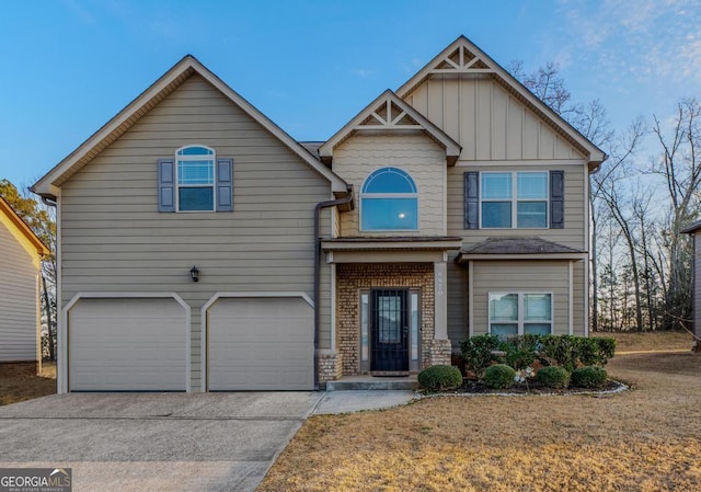 craftsman-style house with a garage, driveway, board and batten siding, and brick siding