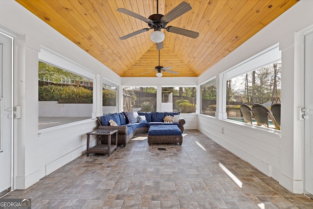 sunroom / solarium with wooden ceiling, lofted ceiling, and ceiling fan