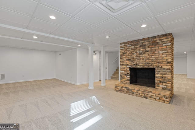 finished below grade area featuring visible vents, recessed lighting, stairs, and carpet floors