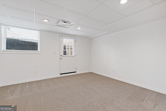 spare room with visible vents, baseboards, carpet floors, recessed lighting, and a paneled ceiling