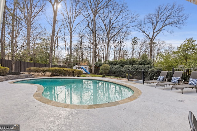 view of pool featuring a fenced in pool, a playground, a patio area, and fence