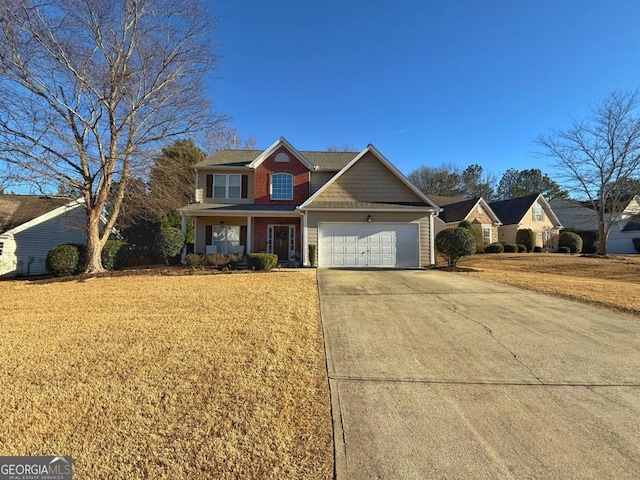 view of front of property with a garage, a front lawn, concrete driveway, and brick siding