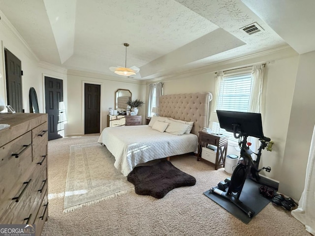 bedroom featuring visible vents, a raised ceiling, crown molding, and light colored carpet