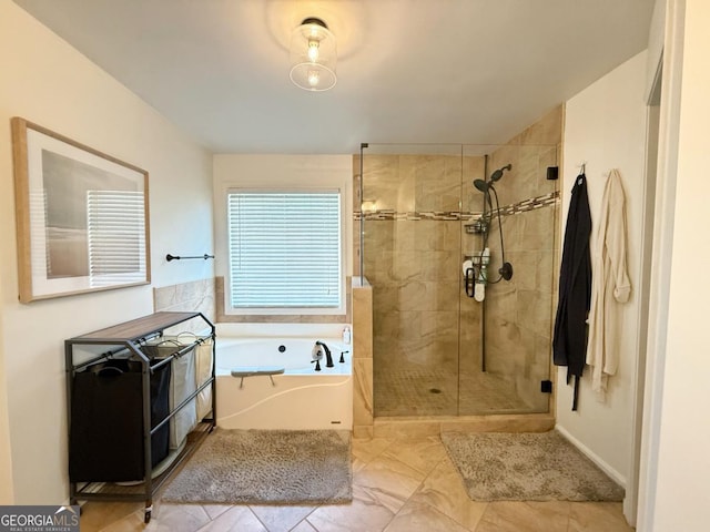 full bath featuring a shower stall and a bath