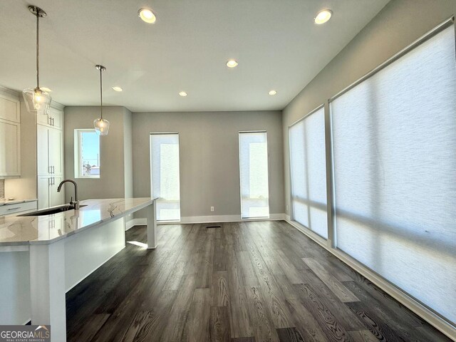 827 Winslow Way NW, Atlanta, GA 30318 - interior space featuring white cabinets, dark wood-style floors, light stone counters, a sink, and recessed lighting