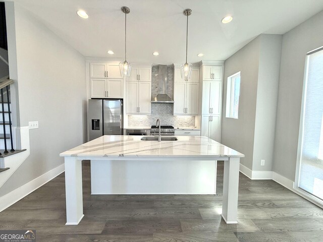 827 Winslow Way NW, Atlanta, GA 30318 - kitchen with a center island with sink, decorative backsplash, wall chimney exhaust hood, stainless steel refrigerator with ice dispenser, and a sink