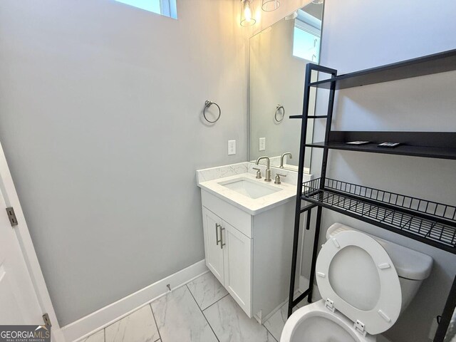827 Winslow Way NW, Atlanta, GA 30318 - half bath with toilet, marble finish floor, vanity, and baseboards