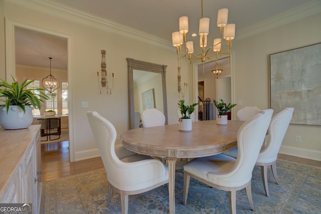 dining room featuring a chandelier, dark wood-style floors, and crown molding