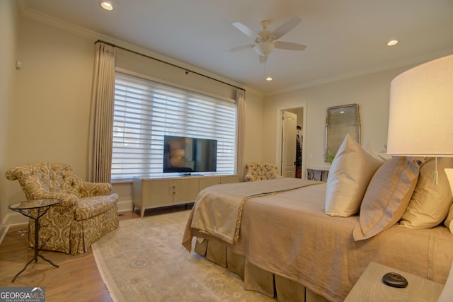 bedroom with ceiling fan, light wood-style flooring, recessed lighting, baseboards, and ornamental molding