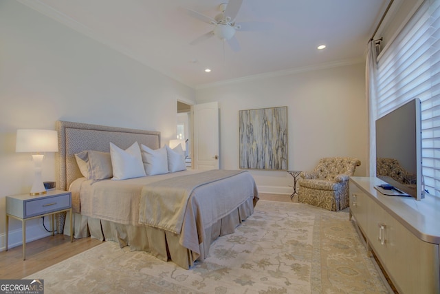 bedroom with light wood-style flooring, baseboards, crown molding, and recessed lighting