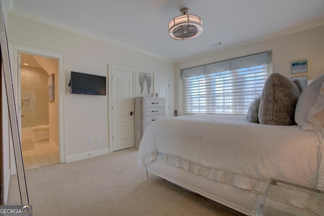 bedroom with light carpet, connected bathroom, baseboards, and crown molding