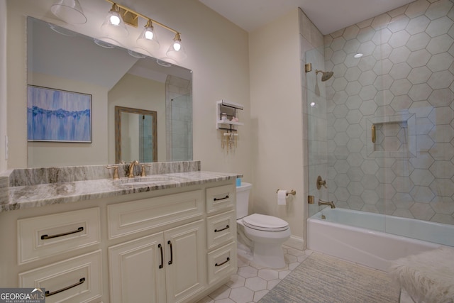 full bathroom featuring washtub / shower combination, vanity, tile patterned flooring, and toilet