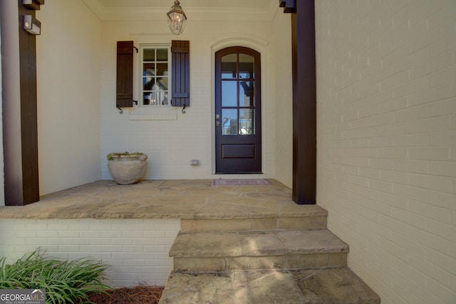 property entrance with brick siding