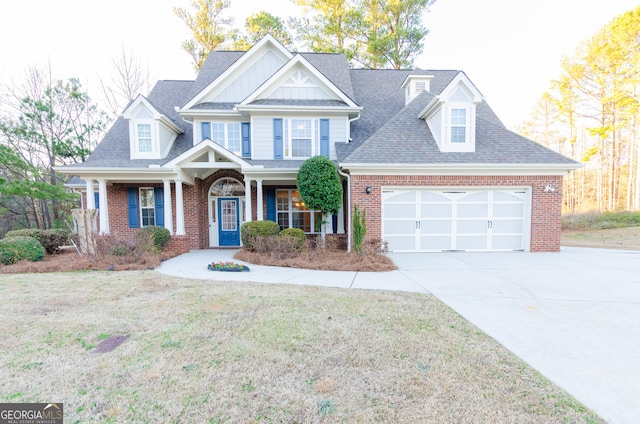 craftsman house with brick siding, roof with shingles, concrete driveway, a garage, and a front lawn