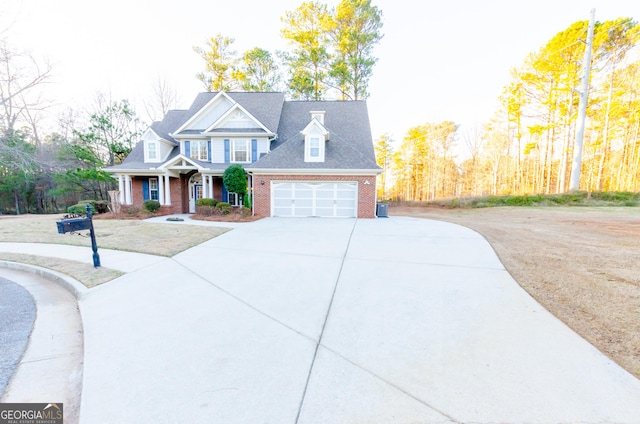 view of front of home with brick siding, driveway, and an attached garage