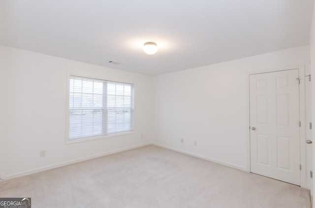 2474 Starfire Ln, Loganville, GA 30052 - empty room featuring light colored carpet and baseboards