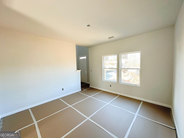 unfurnished bedroom with visible vents and baseboards