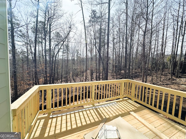 deck featuring a view of trees