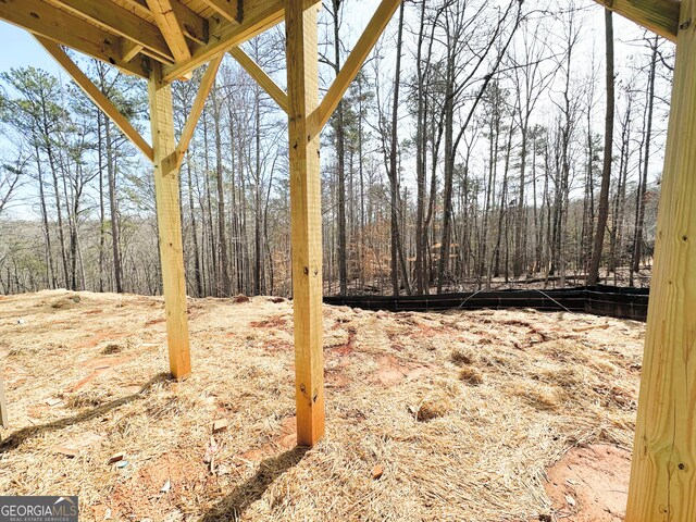 view of yard featuring a view of trees