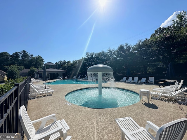 community pool with a patio