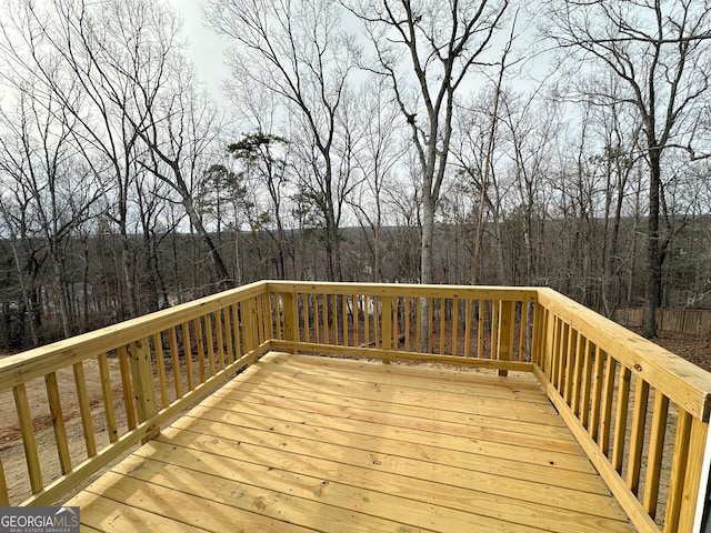 deck featuring a forest view