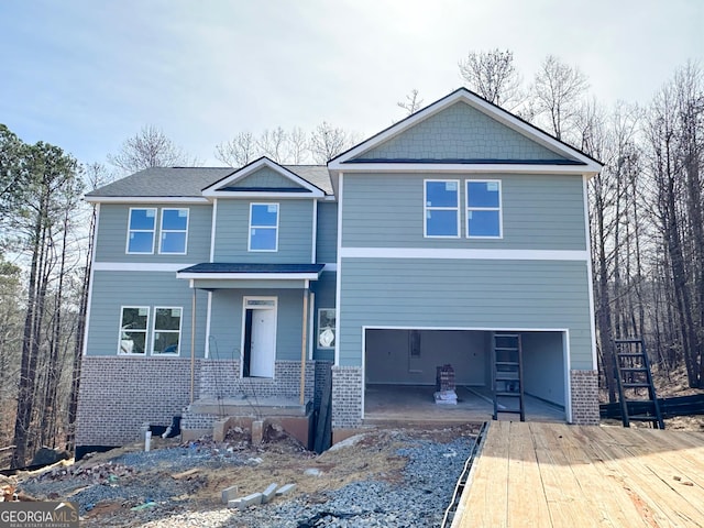 view of front of property with brick siding and an attached garage