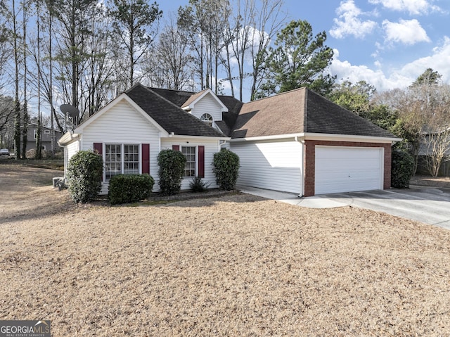 view of front of house with concrete driveway, brick siding, roof with shingles, and an attached garage