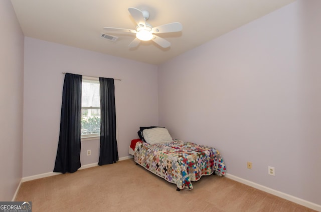 bedroom with a ceiling fan, carpet, visible vents, and baseboards