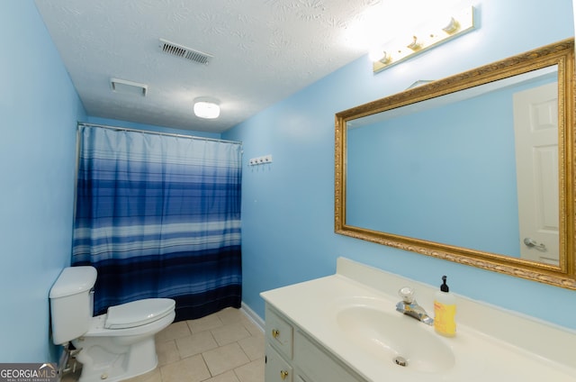 full bathroom with a textured ceiling, toilet, vanity, visible vents, and tile patterned floors