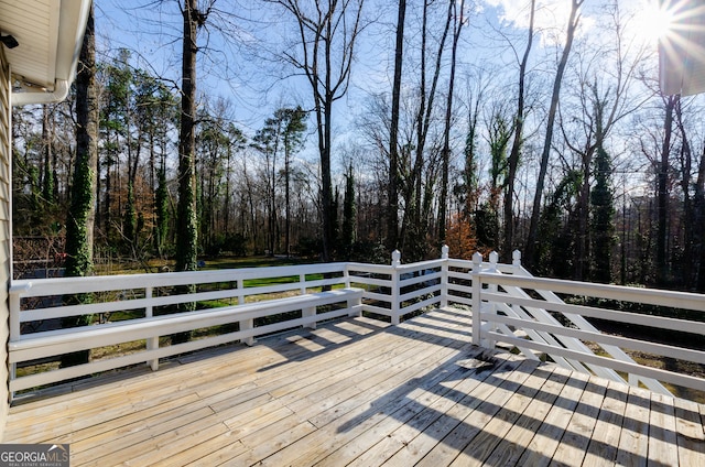 deck featuring a view of trees