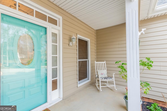 entrance to property featuring a porch