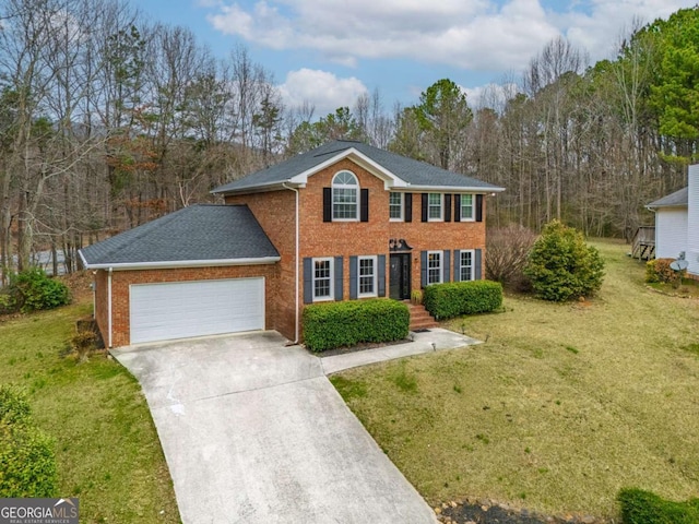 view of front of home featuring an attached garage, a front lawn, concrete driveway, and brick siding