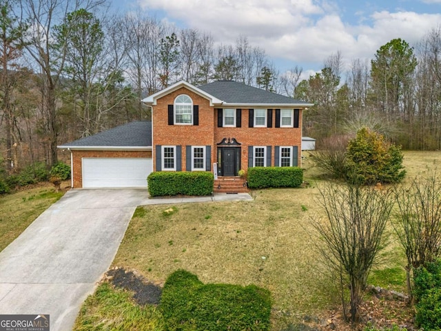 view of front of home with driveway, brick siding, a front lawn, and an attached garage