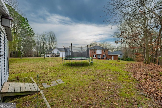 view of yard featuring a trampoline