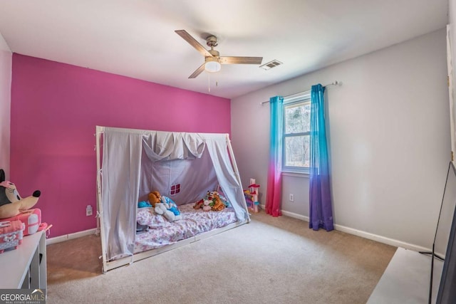 bedroom featuring a ceiling fan, carpet, visible vents, and baseboards