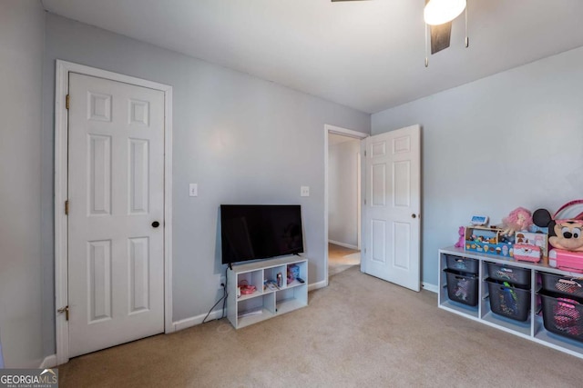 game room featuring ceiling fan, carpet floors, and baseboards