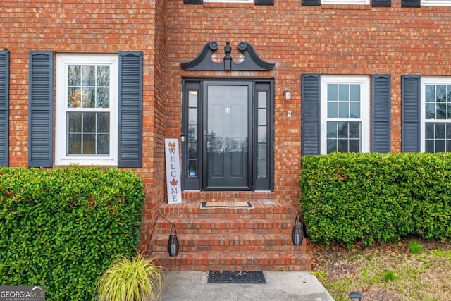 entrance to property with brick siding