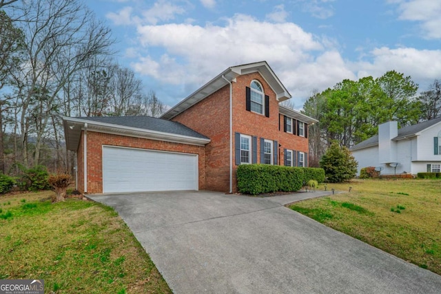 colonial home with a garage, brick siding, driveway, and a front lawn