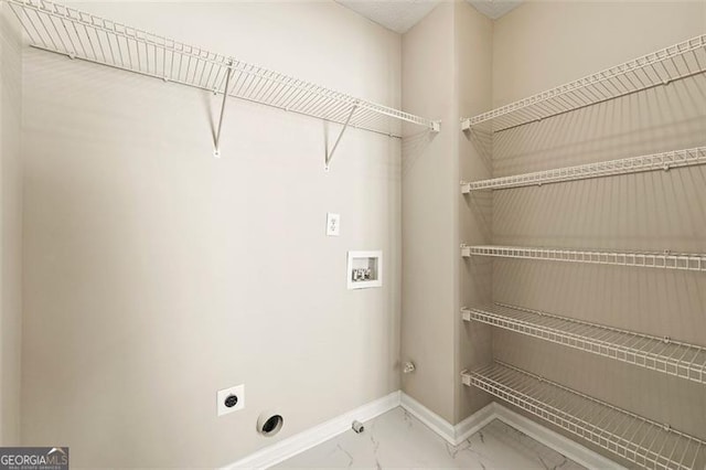 laundry room with laundry area, washer hookup, baseboards, marble finish floor, and electric dryer hookup